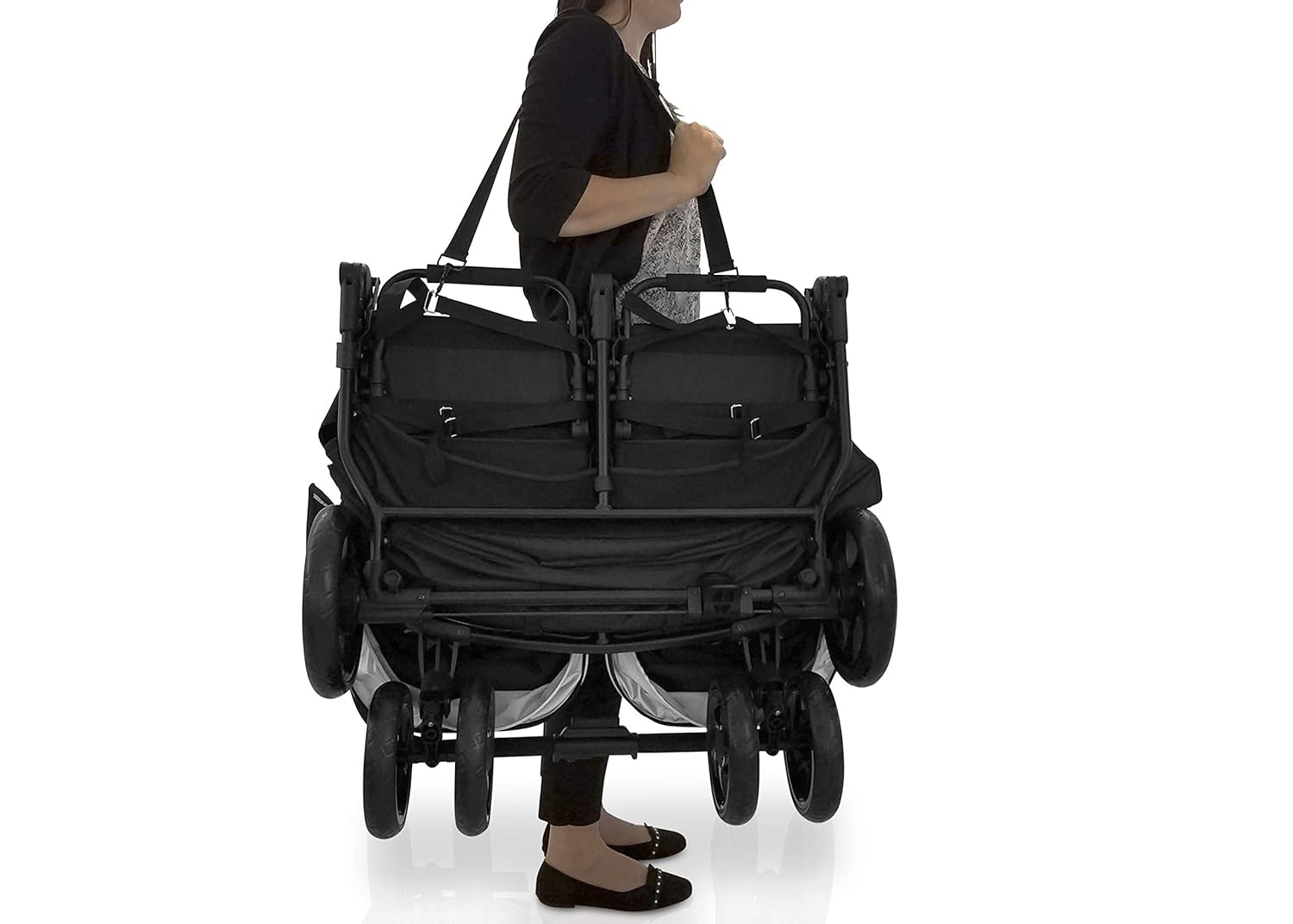 Double stroller being carried by its handle