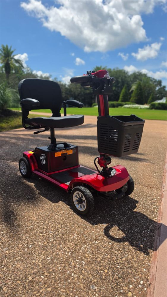 Easy Go Orlando mobility scooter outside a colorful Orlando resort