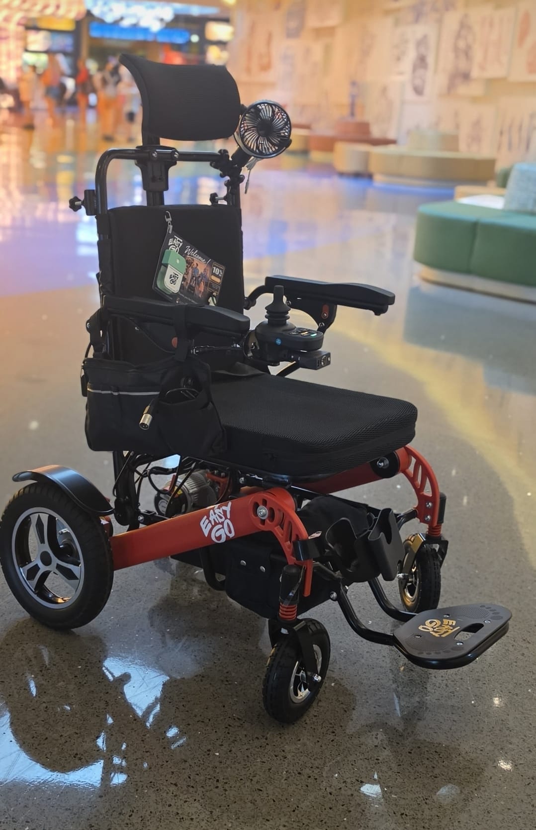 Easy Go Orlando branded electric power wheelchair at an Orlando mall